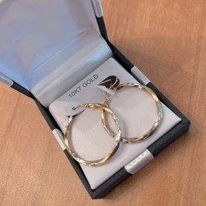 A gold/silver hoop. Never once worn, brand new.